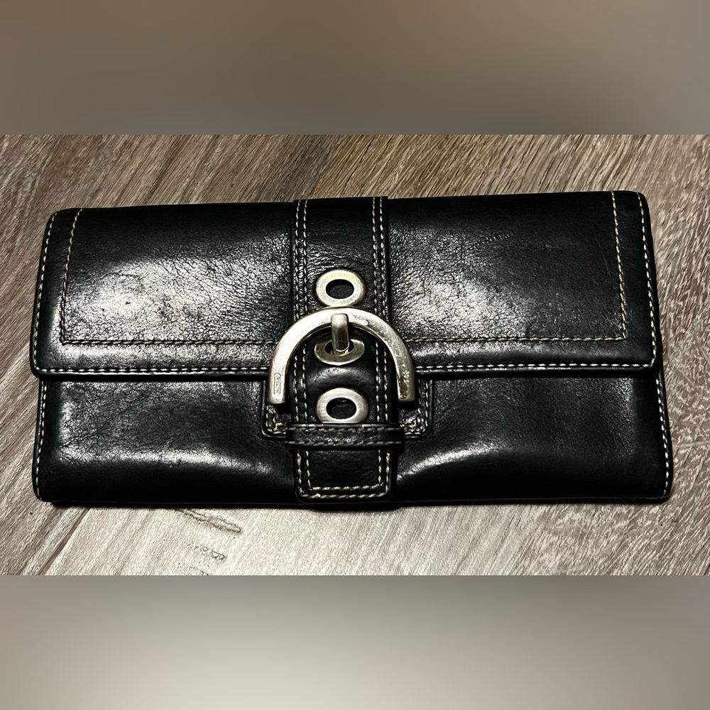 Coach black leather wallet w/ coin pocket, 10 card holders & 4 bill sections.
